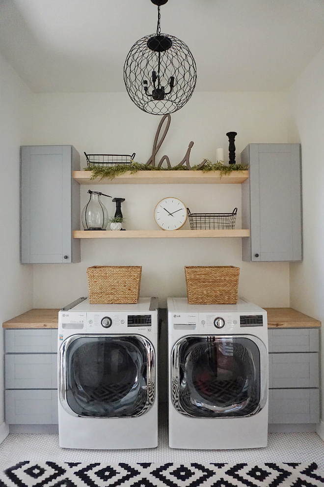 Farmhouse Laundry Room Open Shelves. Since you can see into our laundry room, I wanted it to flow with the style of the rest of our house. So we kept it, clean, modern and a little rustic! We LOVE the open shelving and functionality of the space and the light, rug and decor give it a pop of style! The farmhouse-style laundry room features open shelves, gray shaker cabinets, butcher's block countertop and penny floor tile. Farmhouse Laundry Room Open Shelving Ideas. Laundry Room Open Shelves #farmhouselaundryroom #farmhouse #farmhousestylelaundryroom #farmhousestyle #laundryroom #openshelves #grayshakercabinets #shakercabinets #graycabinets #butchersblock #countertop #pennyfloortile Home Bunch's Beautiful Homes of Instagram @household no.6