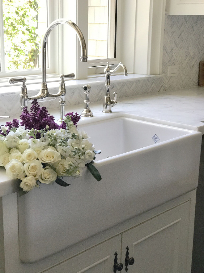 Farmhouse Sink, Honed Marble Countertop and mini herringbone tile backsplash. The main sink is a 36” Shaw farmhouse style with Perrin and Rowe faucet, water dispenser and sprayer. Farmhouse Sink, Honed Marble Countertop and mini herringbone tile backsplash. Farmhouse Sink, Honed Marble Countertop and mini herringbone tile backsplash #FarmhouseSink #HonedMarbleCountertop #miniherringbonetile #backsplash Beautiful Homes of Instagram @SanctuaryHomeDecor