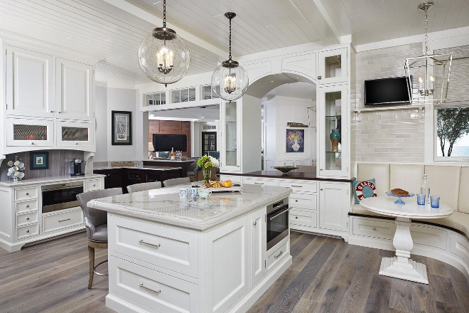 Kitchen with curved Breakfast Nook. This Hamptons-style white kitchen feels private yet connected to the rest of the house. I love the small nook, perfect for snacks or your morning coffee, and the classic tongue and groove ceiling. Kitchen with curved Breakfast Nook design. Kitchen with curved Breakfast Nook ideas. Kitchen with curved Breakfast Nook. Kitchen with curved Breakfast Nook design. Kitchen with curved Breakfast Nook ideas #Kitchen #curvedBreakfastNook #Kitchen #BreakfastNook #Kitchen #BreakfastNookideas Benchmark Wood & Design Studios - Mike Schaap Builders