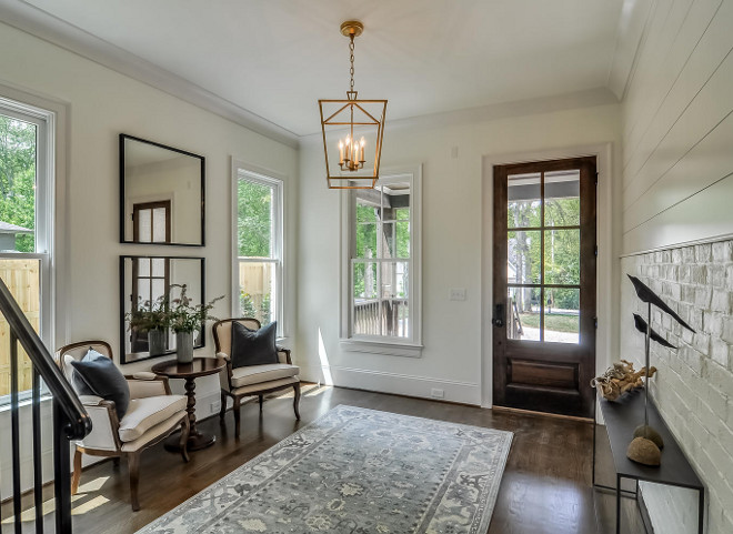 Neutral Foyer with Brass Darlana Lantern. Neutral Foyer with Gilded Gold Darlana Lantern. Lighting is Darlana in Gilded Iron from Visual Comfort. Neutral Foyer with Brass Darlana Lantern. Neutral Foyer with Gilded Gold Darlana Lantern and shiplap and painted brick wall #NeutralFoyer #foyer #brassdarlana #GildedGoldDarlanaLantern #GildedDarlana #DarlanaLantern #paintedbrick Domaine Development