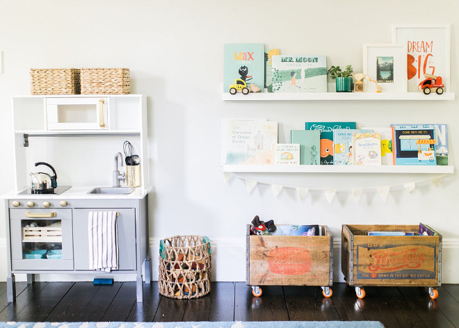 Playroom Toys and Books. Designing a Playroom. Playroom Toys and Books Ideas. Playroom Toys and Books. Book Ledges: Holman Ledge 4 ft in modern white, Pottery Barn. Crates: Flea Market find, orange wheels from Amazon. #PlayroomToysandBooks #PlayroomDesign #PlayroomToys #PlayroomBooks Home Bunch Beautiful Homes of Instagram @finding__lovely