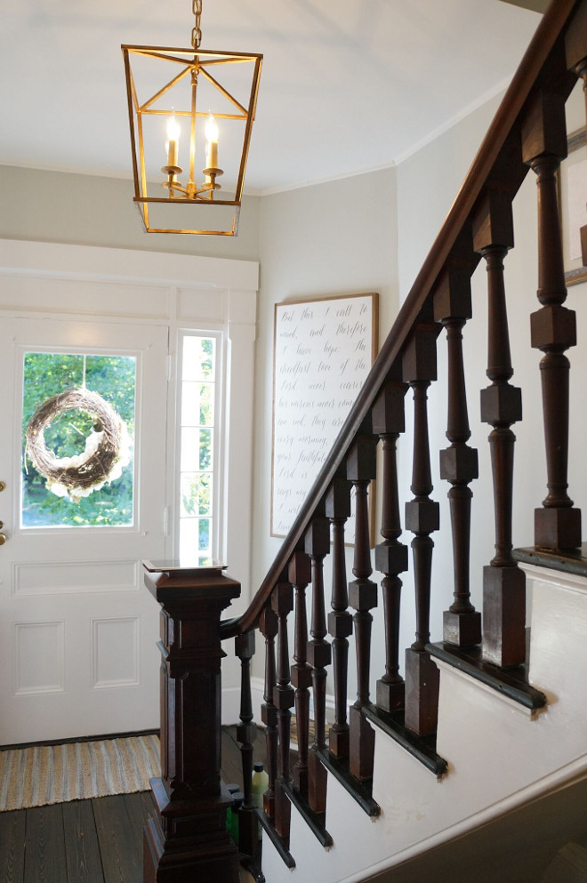 Restoring Old Staicase Ideas. Staircase Restoration. As you enter the home you’re greeted by a lovely old wood staircase. The wall color is Benjamin Moore Grey Owl. The entry light is the Darlana Lantern by Visual Comfort (17”w by 24” h). Staircase Restoration ideas #StaircaseRestoration #oldstaircaserestoration #oldstaircase #restoringoldstaircases #restoringoldstaircaseideas Home Bunch Beautiful Homes of Instagram @finding__lovely