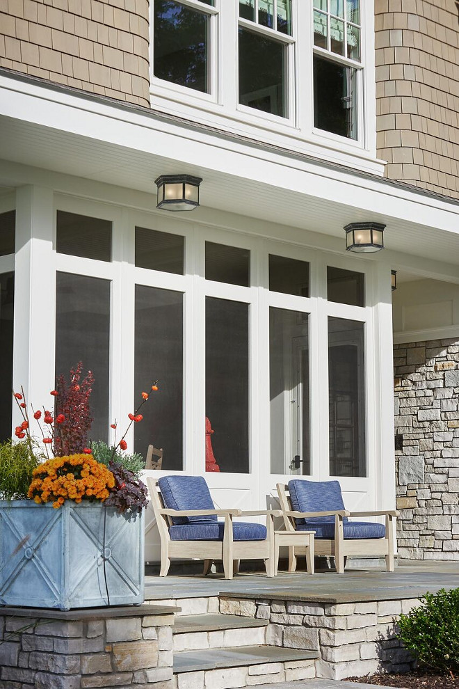 Screened in patio. Screened in patio with Bluestone floor tile and natural stone exterior: Exterior Stone: Belden/Fondulac - Custom Blend - Natural, Slightly Racked. Screened in patio planters #Screenedinpatio #Screenedin #patio #Bluestone #tile #planters #patioplanters Benchmark Wood & Design Studios - Mike Schaap Builders