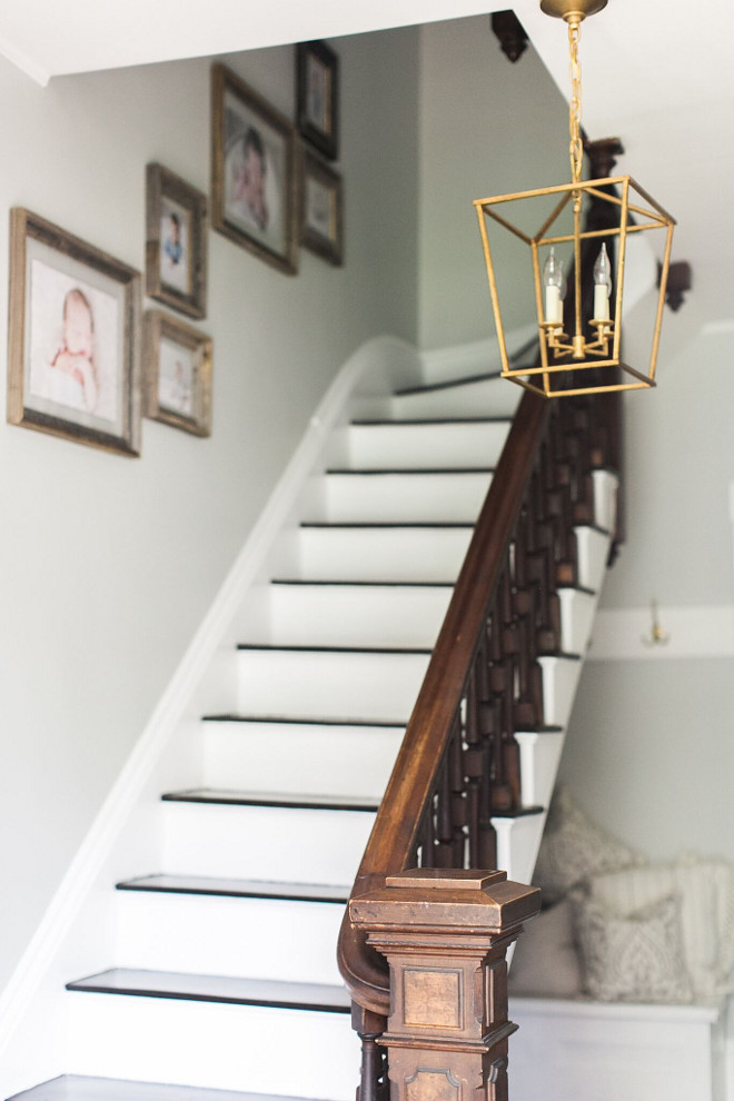 Stair Wall Gallery. Family stair wall gallery ideas. As you enter the home you’re greeted by a lovely old wood staircase. We had pictures taken of our boys at 5 day old, 6 months and one year, framed in barn wood frames and they are our artwork up the stairs. #StairWallGallery #Familywallgallery #wallgallery Home Bunch Beautiful Homes of Instagram @finding__lovely