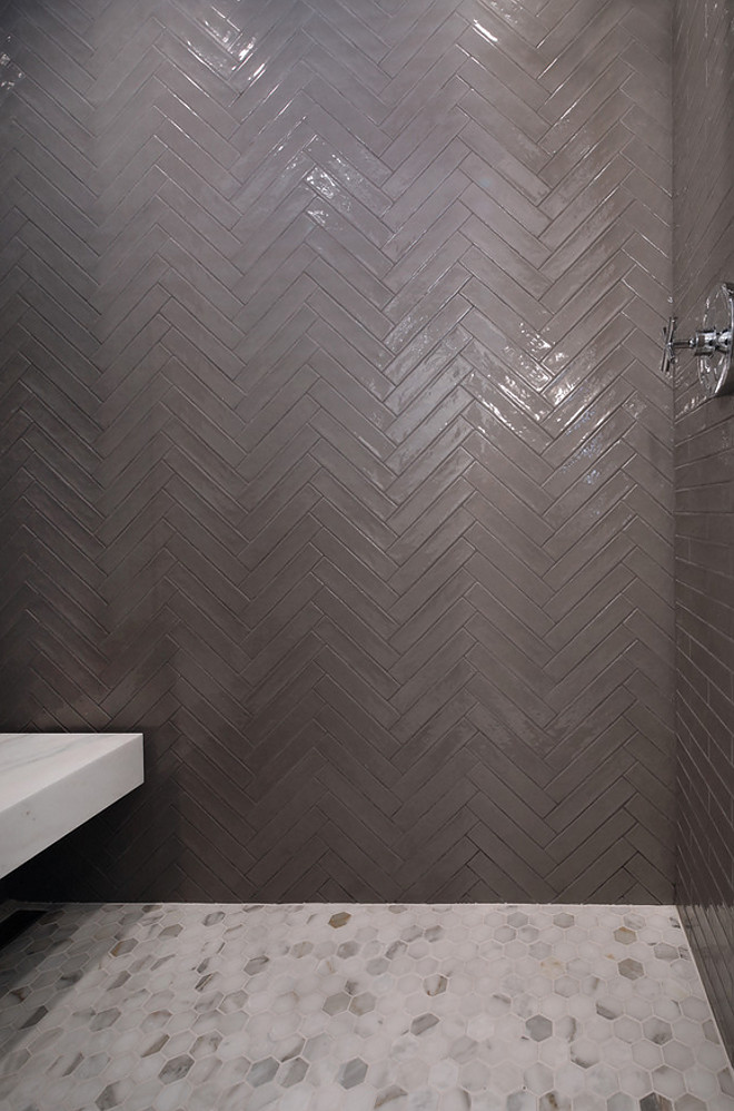 2x10 tile. 2x10 shower tile. 2x10 herringbone shower tile. This shower brings quite the design impact with its grey wall featuring 2x10 Italian-made Piastrell Grigio set in a herringbone pattern. #2x10tile #showertile #2x10showertile #2x10showertileideas #2x10herringboneshowertile #2x10herringbonetile Patterson Custom Homes
