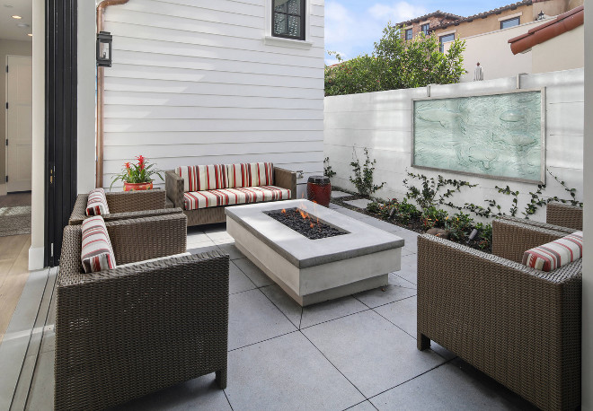 A courtyard with fire pit off the main living space offers the perfect escape for a glass of wine at the end of a long day. Patterson Custom Homes