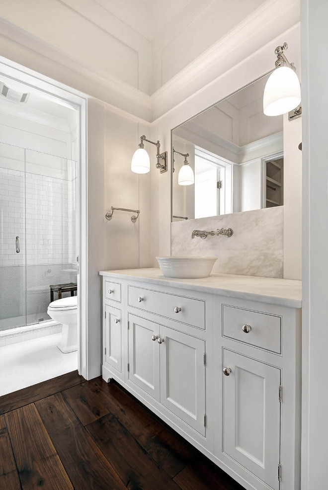 Bathroom features hardwood flooring in the vanity area and tile flooring in the shower area. Lighting is Visual Comfort. Faucet and sink are Waterworks (Hancock Waterworks sink). Robyn Hogan Home Design