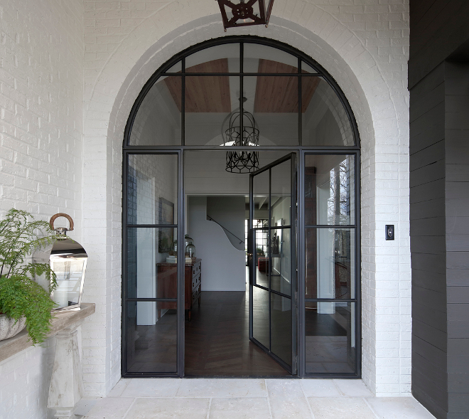 Black Steel Front Door. Arched Black Steel Front Door. Black Steel Front Door and sidelights #BlackSteelFrontDoor #BlackSteelDoor Christopher Architecture & Interiors