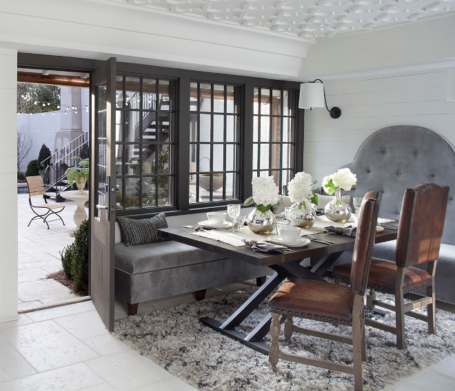 Black steel windows and shiplap. Breakfast room features shiplap wall paneling, custom ceiling design and black steel windows and door. Black steel windows and shiplap. Breakfast room features shiplap wall paneling, custom ceiling design and black steel windows and door #Blacksteelwindow #Blacksteelwindows #shiplap #Breakfastroom #shiplapwallpaneling #customceilingdesign #blacksteelwindowideas #blacksteeldoor Christopher Architecture & Interiors