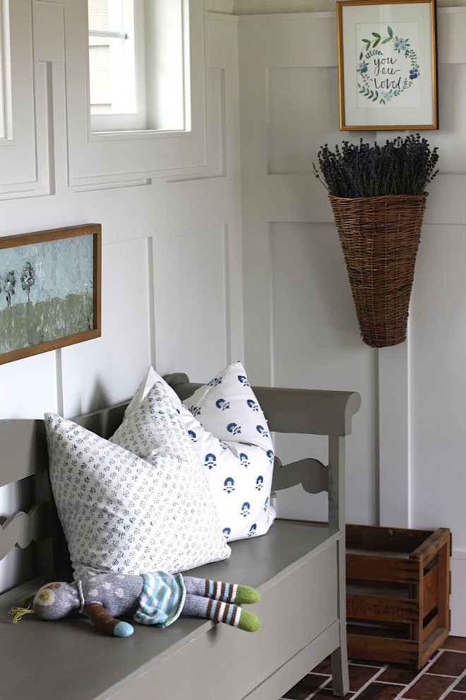 Board and Batten Grid Paneling. Mudroom featuring brick floors and Board and Batten Grid Paneling. The board and batten grid paneling paint color is Benjamin Moore White Dove. Board and Batten Grid Paneling #BoardandBattenGrid #Paneling Home Bunch's Beautiful Homes of Instagram @blessedmommatobabygirls