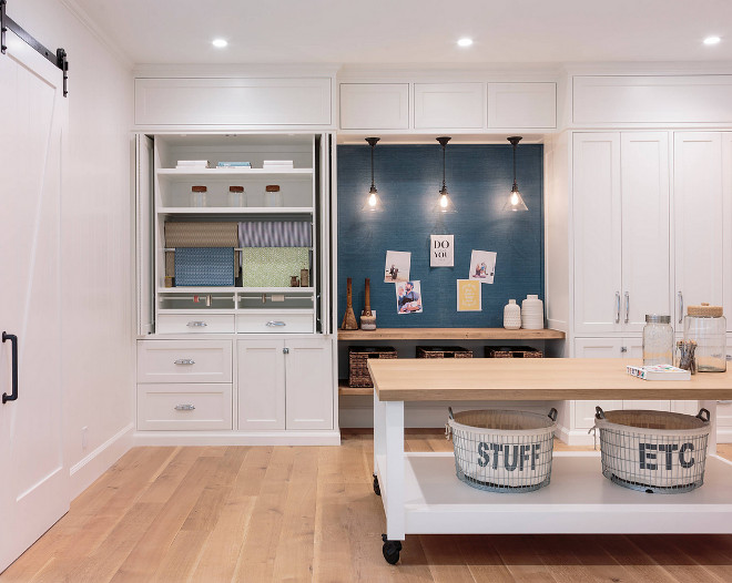 Craftroom. Modern Farmhouse Craftroom with inset cabinets, wrapping station and a large island on wheels. The wrapping station features a wall covered in dyed seagrass wallpaper over-layed onto a cork board. This is any easy way to transform a cork board into a statement wall! Craftroom. Modern Farmhouse Craftroom with inset cabinets, wrapping station and a large island on wheels. Craftroom. Modern Farmhouse Craftroom with inset cabinets, wrapping station and a large island on wheels. Craftroom. Modern Farmhouse Craftroom with inset cabinets, wrapping station and a large island on wheels #Craftroom #ModernFarmhouseCraftroom #FarmhouseCraftroom #Craftrooms #insetcabinets #wrappingstation #largeisland #islandwheels Haefele Design