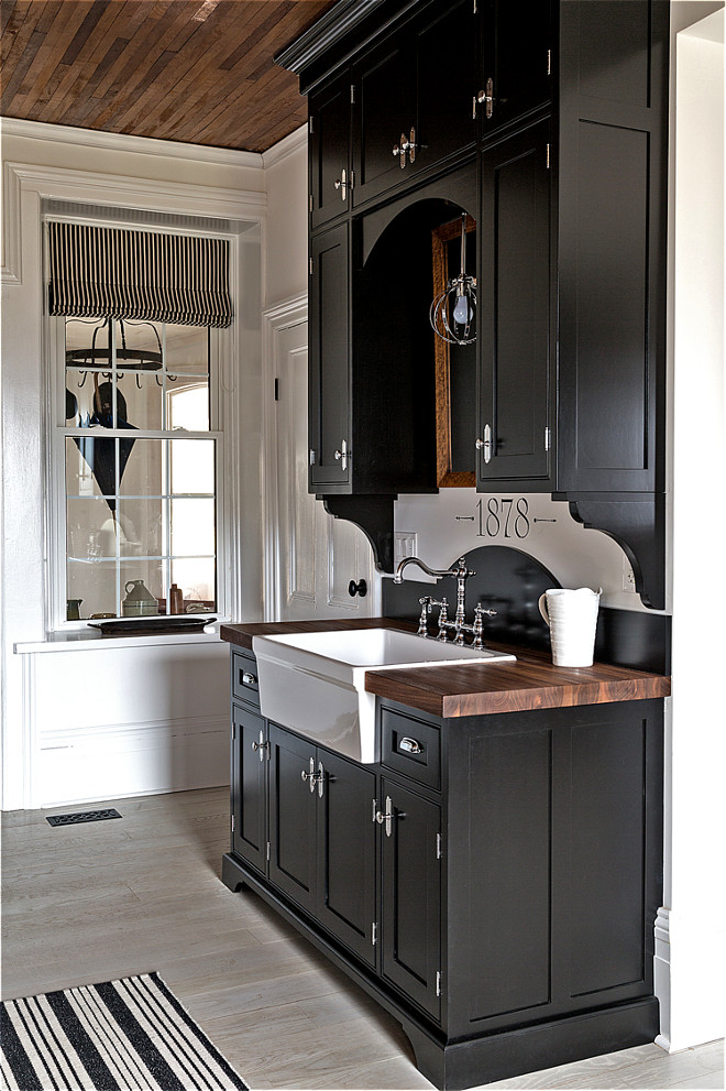 Farmhouse black kitchen cabinet with walnut butchers block countertop and farmhouse sink. Farmhouse black kitchen cabinet with walnut butchers block countertop and farmhouse sink. Farmhouse black kitchen cabinet with walnut butchers block countertop and farmhouse sink #Farmhousekitchen #blackkitchen #blackkitchencabinet #walnutbutchersblock #countertop #farmhouse #farmhousesink Home Bunch's Beautiful Homes of Instagram Cynthia Weber Design @Cynthia_Weber_Design