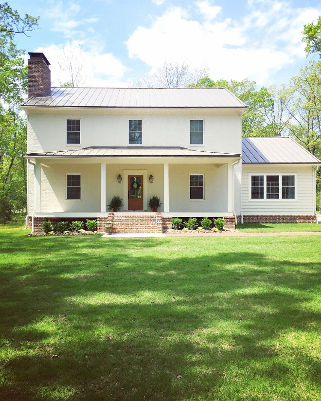 Farmhouse exterior with metal roof and brick accent. In an effort to get that old southern charm with a coastal/farmhouse flair, and the feel of an older home, we bricked the main section of the home and painted it a light cream, leaving the skirt brick exposed. To break it up and give some interest, we used wide plank James Hardie siding on the one story section of the home. It too, has the exposed brick skirt. Also on this section of the home, we used board and batten on the gable. We kept the design very symmetrical, with clean lines, classic elements and no fuss trim. Off white Farmhouse exterior with metal roof and brick accent. Farmhouse exterior with metal roof and brick accent ideas #Farmhouse #Farmhouseexterior #modernFarmhouse #modernFarmhouseexterior #metalroof #brickexterior #exterioraccent Beautiful Homes of Instagram @theclevergoose