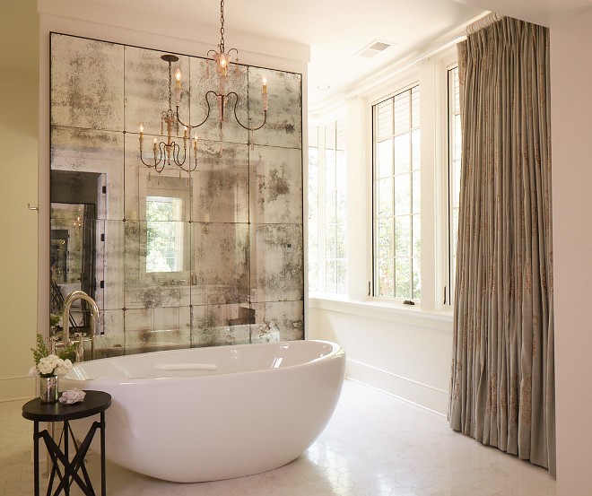 French Bathroom with oval freestanding tub, large antique mirror and French pleat draperies. French Bathroom with freestanding tub, large antique mirror and French pleat draperies #FrenchBathroom #ovalfreestandingtub #ovaltub #largeantiquemirror #antiquemirror #Frenchpleatdraperies Christopher Architecture & Interiors