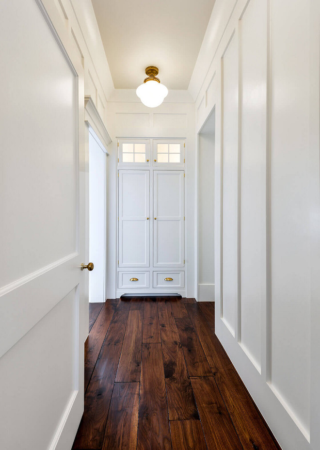 Hall Linen Closet. Hall with board and batten walls, solid walnut hardwood floors and shaker linen closet #hall #linencloset #boardandbatten #walnuthardwoodflooring Robyn Hogan Home Design