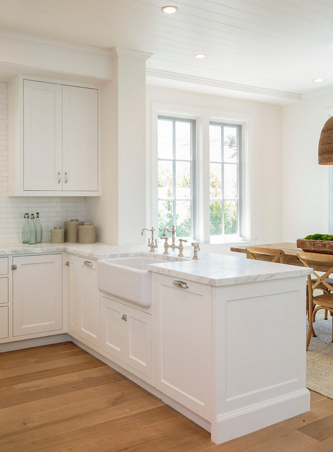 Kitchen Peninsula with farmhouse sink. Farmhouse sink Peninsula. The kitchen peninsula features a large farmhouse sink. Cabinet and walls paint color is very similar to Benjamin Moore OC-17 White Dove. Farmhouse sink Peninsula Ideas. Kitchen Peninsula with farmhouse sink Ideas. Kitchen Peninsula with farmhouse sink #KitchenPeninsulafarmhousesink #KitchenPeninsula #farmhousesink #KitchenPeninsulafarmhousesink Haefele Design