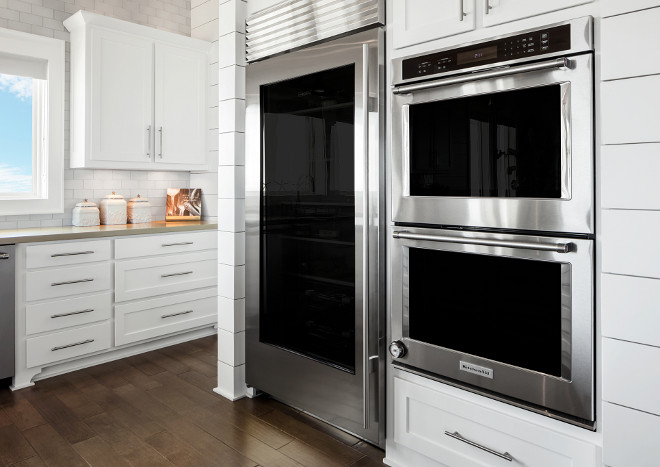 Kitchen Shaker Style cabinetry and shiplap accent. Cabinets and shiplap are painted in Sherwin Williams Pure White SW 7005. Kitchen Shaker Style cabinetry and shiplap accent ideas. Kitchen Shaker Style cabinetry and shiplap accents. Kitchen Shaker Style cabinetry and shiplap accent #Kitchen #ShakerStylecabinetry #kitchenshiplap Julie Barrett Design