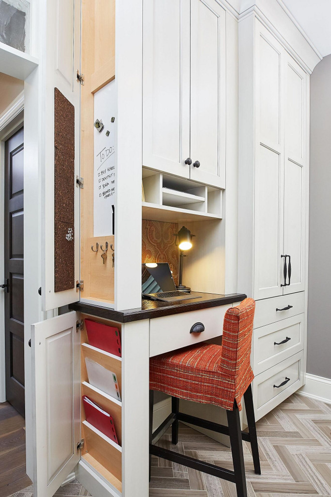 Mudroom Desk with Key Storage and message board on side of cabinet. The mudroom features a very smartly designed built-in desk with key and file storage and message board on side of cabinet. This idea deserves to be saved! Mudroom Desk with Key Storage and message board on side of cabinet. Mudroom Desk with Key Storage and message board on side of cabinet #Mudroom #Desk #KeyStorage #messageboard #sideofcabinetstorage Mike Schaap Builders