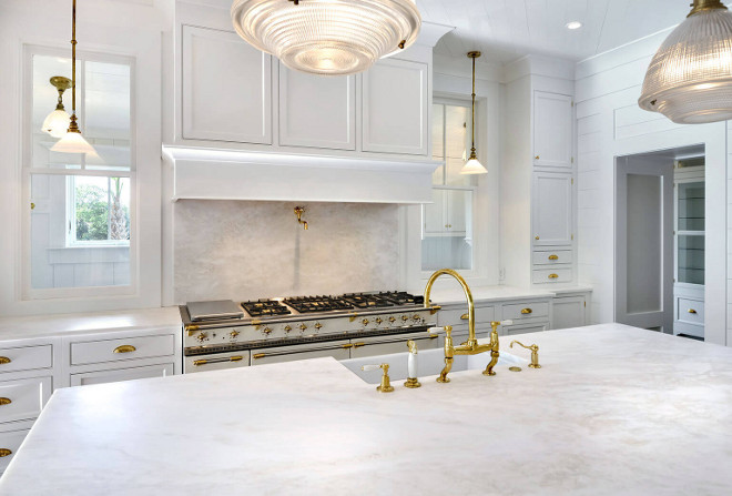 White Marble: Kitchen features Namibia Bright White marble countertop, backsplash wall and coffee center. Slabs were selected for their soft, clean bright white color and soft "Natural Linen" colored veining. Robyn Hogan Home Design