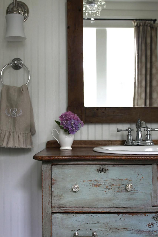 Old Distressed Dressed as vanity. Repurposed old dresser turned into bathroom vanity. The vanity is an antique chest I found for $120, painted it in Miss Mustard Seed milk paint, re-stained the top and Jeffrey cut the top and installed the $30 sink from Lowes. The paint color is a mixture of kitchen scale and Ironstone paint, then waxed with Marian's antiquing wax. Repurposed old dresser turned into bathroom vanity ideas. DIY Repurposed old dresser bathroom vanity. Home Bunch's Beautiful Homes of Instagram @blessedmommatobabygirls