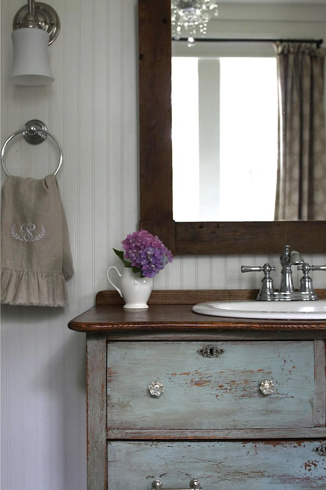 Old Distressed Dressed as vanity. Repurposed old dresser turned into bathroom vanity. The vanity is an antique chest I found for $120, painted it in Miss Mustard Seed milk paint, re-stained the top and Jeffrey cut the top and installed the $30 sink from Lowes. The paint color is a mixture of kitchen scale and Ironstone paint, then waxed with Marian's antiquing wax. Repurposed old dresser turned into bathroom vanity ideas. DIY Repurposed old dresser bathroom vanity. Home Bunch's Beautiful Homes of Instagram @blessedmommatobabygirls