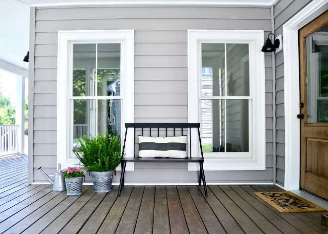 Porch Bench. The front porch wraps around to the side entry which leads into our mudroom and kitchen area. The bench was a fun find from Target this year and adds some charm and seating to our front porch. #porch #bench Home Bunch's Beautiful Homes of Instagram @sweetthreadsco