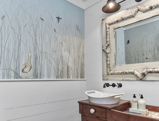 Powder room mural and vintage mirror and vintage vanity. Coastal farmhouse Powder room mural, shiplap walls and vintage mirror and vintage vanity #shiplap #powderroom #murals #vintagemirror #vintagevanity Nancy Serafini Interior Design