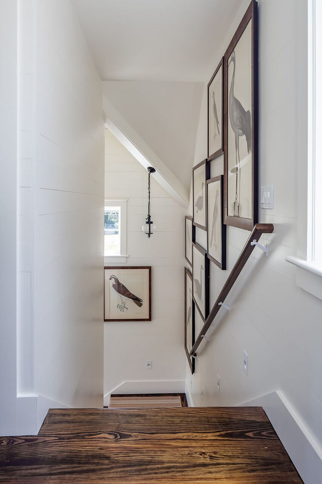 Shiplap stairway with antique pine hardwood floors and large gallery wall frames. This stairway features antique pine hardwood floors, shiplap walls and a gallery wall with large frames. Stunning! Shiplap stairway with antique pine hardwood floors and large gallery wall frames. Shiplap stairway with antique pine hardwood floors and large gallery wall frames. Shiplap stairway with antique pine hardwood floors and large gallery wall frames #Shiplap #stairway #antiquepine #hardwood #floors #gallerywall #largeframes Nancy Serafini Interior Design