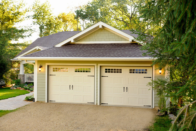 Siding and garage door paint color ideas. The siding color is Benjamin Moore Cypress Green. The trim, soffit and fascia color is Benjamin Moore Cameo White. The color of the garage door color is Benjamin Moore Almond Bisque. Door is made by ELK corp. Raised profile garage door #exterior #paintcolor #shiding #garagedoors JG Development, Inc.