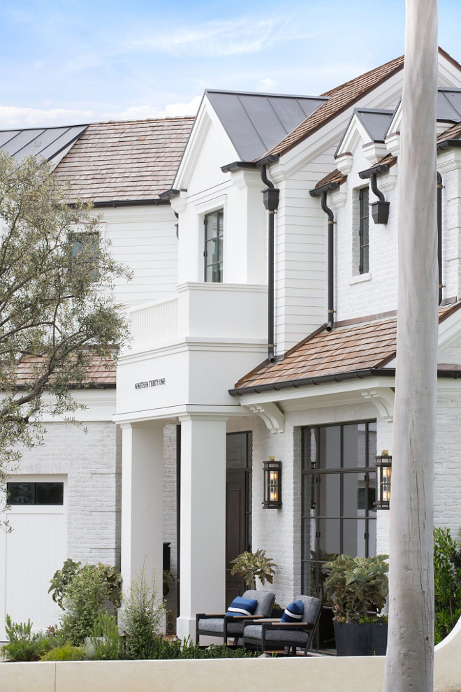 White Exterior with black Gutter and Downspouts. Black zinc gutters and downspouts contrast with the white exterior. White Exterior with Gutter and Downspouts. White Exterior with black Gutter and Downspouts. White Exterior with black Gutter and Downspouts #WhiteExterior #blackGutter #gutter #Downspouts Patterson Custom Homes