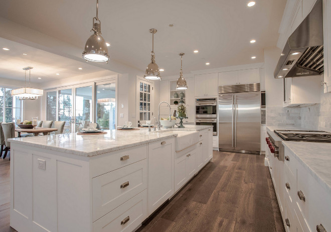 White Marble Island and White Marble Perimeter Countertop. This white kitchen features polished white marble countertop on the island and on the perimeter cabinets. The countertop is Carrara White Polished Marble from MSI. Polished White Marble Island and White Marble Perimeter Countertop. White Marble Island and White Marble Perimeter Countertop #WhiteMarbleIslandCountertop #WhiteMarblePerimeterCountertop #IslandCountertop #PerimeterCountertop Calista Interiors