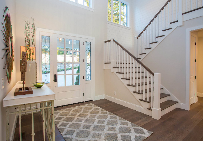 Wide Plank Hardwood and shiplap paneling. Foyer Wide Plank Hardwood and shiplap paneling. Paint Color is Benjamin Moore OC-130 Cloud White. Neutral Foyer Wide Plank Hardwood and shiplap paneling ideas. Wide Plank Hardwood and shiplap paneling #WidePlankHardwood #Hardwood #shiplap #paneling #shiplappaneling Calista Interiors