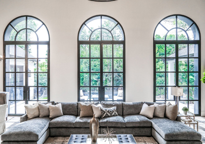 Black French Doors. Iron French Doors. Black Iron Doors. Living room Iron Doors. This exquisite home also features three 15'x7' iron French doors. #IronDoors #blackdoors Tree Haven Homes. Danielle Loryn Design