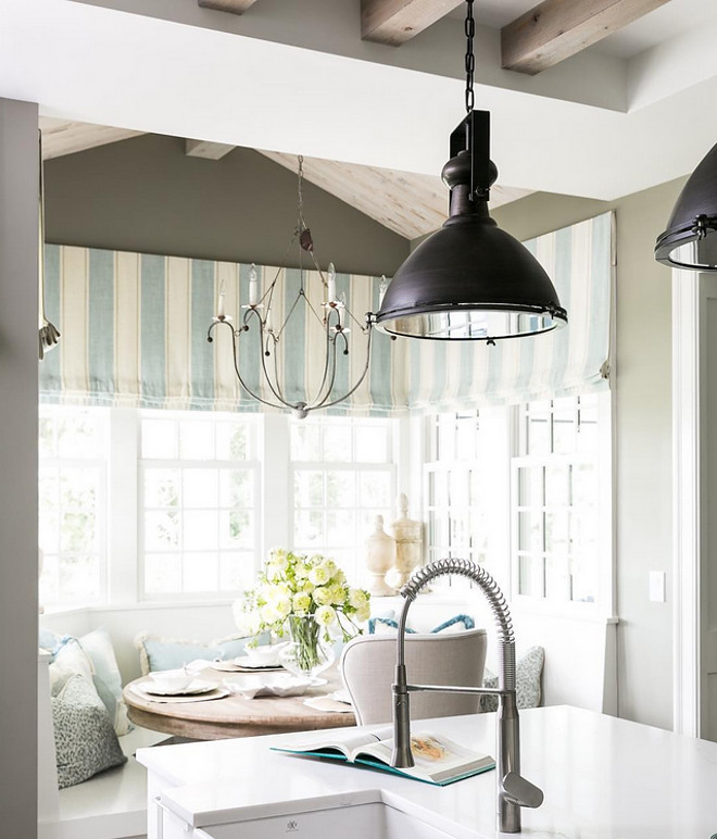 Breakfast Nook. Beautiful breakfast nook with custom banquette and custom window treatment. #banquette #breakfastnook #windowtreatment Artisan Signature Homes