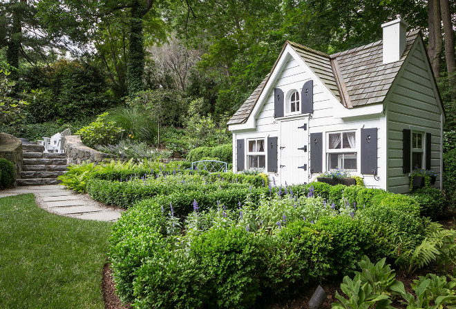 Garden Shed. Garden Shed with white siding and black shutters. Hobbs-Care