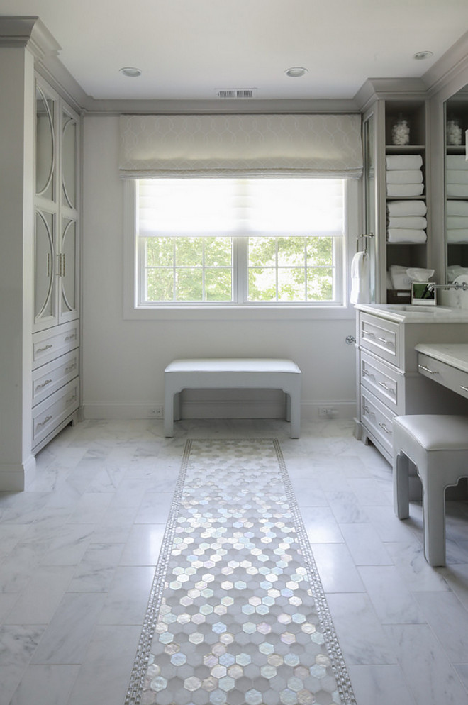 Bathroom Marble Tile Runner. Bathroom features marble floor tile with hex white marble tile runner and glass tile boarder #bathroomtile #marbletile #bathroomtilerunner #tilerunner #tileboarder Hartley and Hill Design