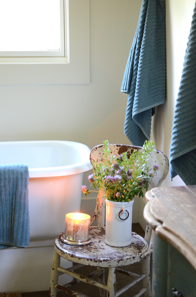 Farmhouse Bathroom Decor. A heavily distressed vintage chair brings a farmhouse feel to this bathroom. Farmhouse Bathroom Decor. Farmhouse Bathroom Decor. Farmhouse Bathroom Decor #FarmhouseBathroomDecor #Farmhouse #BathroomDecor #FarmhouseDecor Beautiful Homes of Instagram @SanctuaryHomeDecor