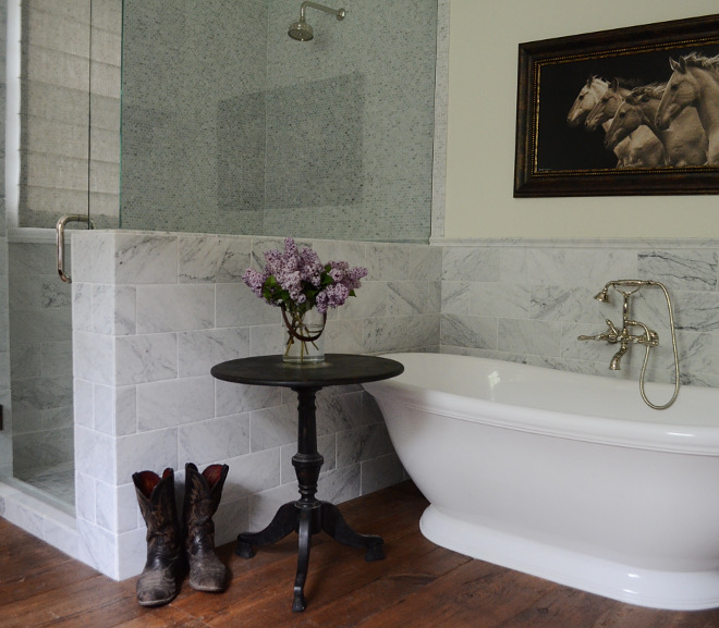 Chic Farmhouse Bathroom. Use Carrera marble for the shower walls and the wainscoting around the freestanding bathtub. Farmhouse Bathroom #FarmhouseBathroom Beautiful Homes of Instagram @SanctuaryHomeDecor