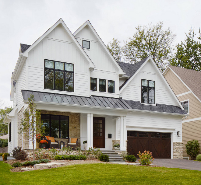 Farmhouse exterior with white siding, white board and batten and neutral exterior stone. Wood front door and wood garage door, black framed windows. Farmhouse exterior with white siding, white board and batten and neutral exterior stone. Wood front door and wood garage door, black framed windows. Farmhouse exterior with white siding, white board and batten and neutral exterior stone. Wood front door and wood garage door, black framed windows. Farmhouse exterior with white siding, white board and batten and neutral exterior stone. Wood front door and wood garage door, black framed windows. Farmhouse exterior with white siding, white board and batten and neutral exterior stone. Wood front door and wood garage door, black framed windows #Farmhouseexterior #whitesiding #whiteboardandbatten #boardandbatten #neutralexterior #exteriorstone #Woodfrontdoor #woodgaragedoor #blackframedwindows Summit Signature Homes, Inc.