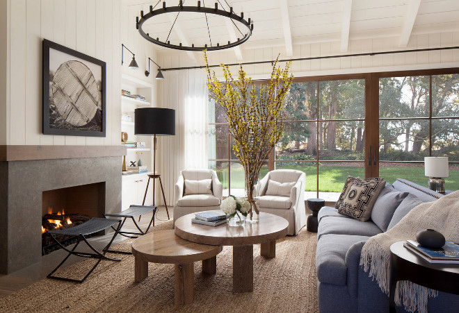 Farmhouse living room with vertical shiplap, Limestone fireplace surround and large glass doors. Farmhouse living room with vertical shiplap, Limestone fireplace surround and large glass doors. Farmhouse living room with vertical shiplap, Limestone fireplace surround and large glass doors #Farmhouselivingroom #verticalshiplap #Limestone #fireplacesurround #largeglassdoors Jennifer Robin Interiors