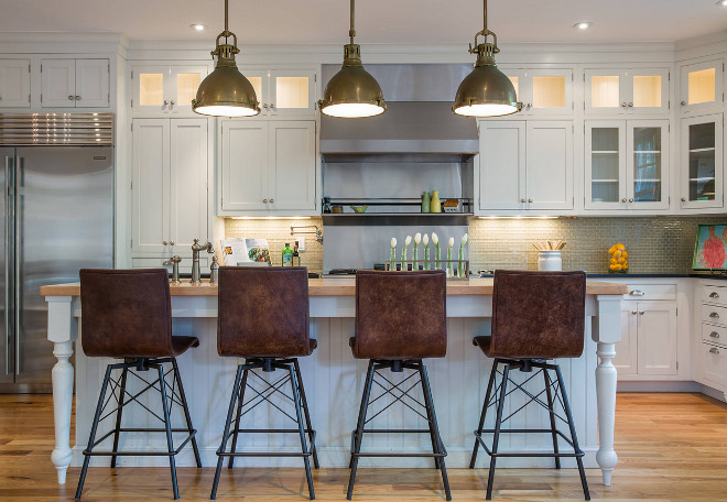 Kitchen Leather Counterstools. Classic white kitchen with leather counterstools. This white kitchen has a traditional look but it's layered with industrial and modern elements. #kitchen #counterstools Restyle Design, LLC.