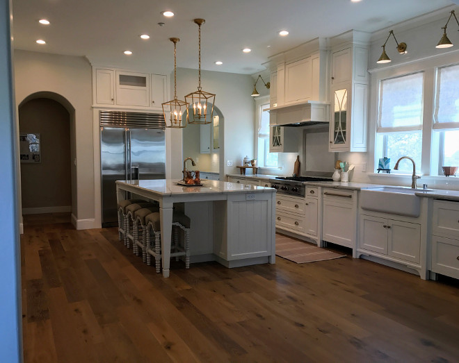 New Classic White Kitchen. New Classic White Kitchen with brass hardware and brass lighting. New Classic White Kitchen #NewClassicWhiteKitchen Home Bunch Interior Design