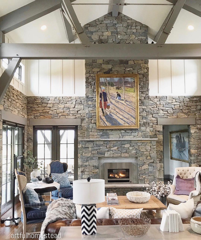 Stone and board and batten living room. Beams and trims are Sherwin Williams SW 0023 Pewter Tankard. Beams are painted in a grey color to unify with natural stone #stone #naturalstone #boardandbatten #beams @artfulhomestead