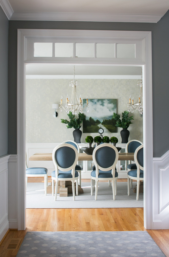 Traditional Dining room. The foyer wall paint color is Benjamin Moore Affinity Storm-700. Traditional Dining room chandelier. Traditional Dining room chairs. Traditional Dining room rug. Traditional Dining room millwork. Traditional Dining room table #TraditionalDiningroom #BenjaminMooreAffinityStorm700 #BenjaminMooreStorm Hartley and Hill Design