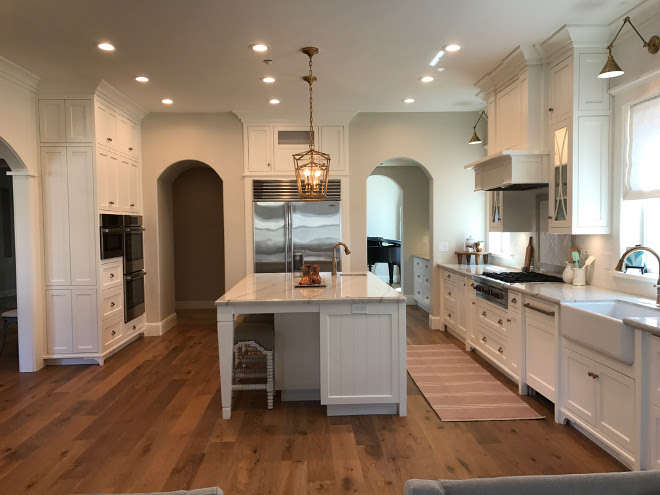 White kitchen cabinet paint color Benjamin Moore Simply White. Wall paint color is Benjamin Moore Winds Breath OC-24 and it works beautifully with the Benjamin Moore Simply White cabinets. Benjamin Moore Winds Breath OC-24 wall color. White kitchen paint color. White kitchen cabinet paint color Benjamin Moore Simply White. Benjamin Moore Winds Breath OC-24 wall color. White kitchen paint color Home Bunch Interior Design