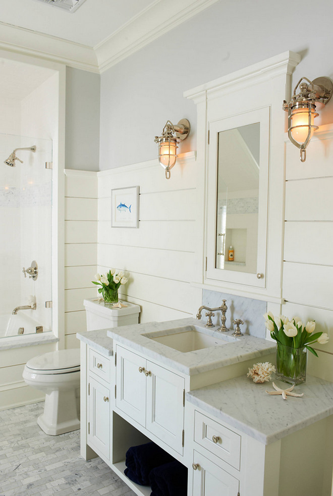 Beach House Bathroom Design with shiplap walls and coastal lighting. Shoreline Painting & Drywall, Inc
