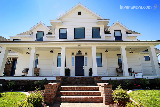 Benjamin Moore OC-17 White Dove exterior with brick porch steps. Home features white siding painted in Benjamin Moore OC-17 White Dove and brick porch steps Millhaven Homes. Caitlin Creer Interiors.