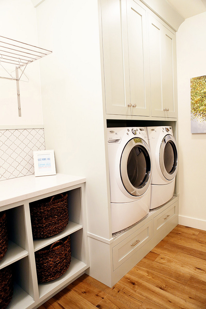 Elevated washer and dryer. Laundry room with elevated washer and dryer - great idea to help your back and add extra storage! Cabinet paint color is Benjamin Moore Gray Cashmere. Laundry room with Elevated washer and dryer. Laundry room with built-in cabinets and elevated washer and dryer #Elevatedwasheranddryer #laundryroom Millhaven Homes. Caitlin Creer Interiors