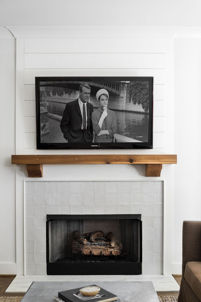Fireplace 4x4 glazed white tile, timber mantel and shiplap paneling. I am loving this clean look of this fireplace. It features 4x4 glazed white tile, custom wood mantel and shiplap paneling. Fireplace 4x4 glazed white tile, timber mantel and shiplap paneling #Fireplace #4x4glazedwhitetile #timbermantel #shiplap #paneling Willow Homes
