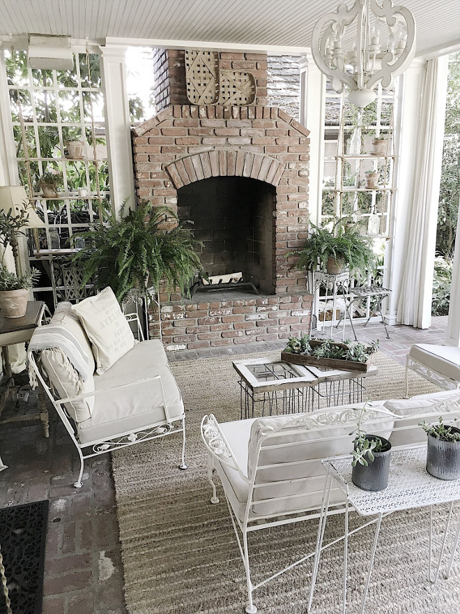 Fixer upper farmhouse back porch ideas. The back porch is used just like another room in our home. With the fireplace and heaters in the ceiling, we use the room year round. #fixerupper #backporch #homedecor #ideas Beautiful Homes of Instagram @my100yearoldhome